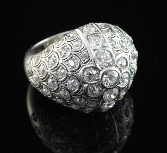 A white metal and pave set diamond cocktail ring, size M.